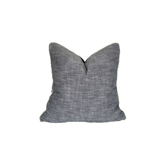 Chamberey pillow with a denim back plate, finished with raw cording is textured, fun and perfect for high activity areas.