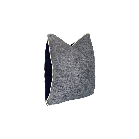 Chamberey pillow with a denim back plate, finished with raw cording is textured, fun and perfect for high activity areas.