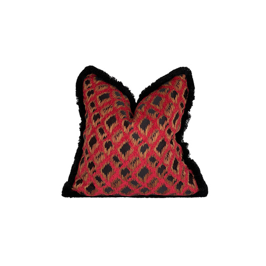 Square pillow with roba de lléngos 'cloth of the Tongues' ikat print with red back and black and amber blur and breed, Finished with black brush fringe.