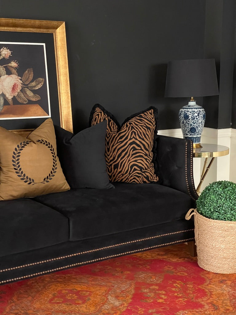 Black velvet sofa layered with Donatella, Tigris and Phantom pillows – Bohemia Lifestyle