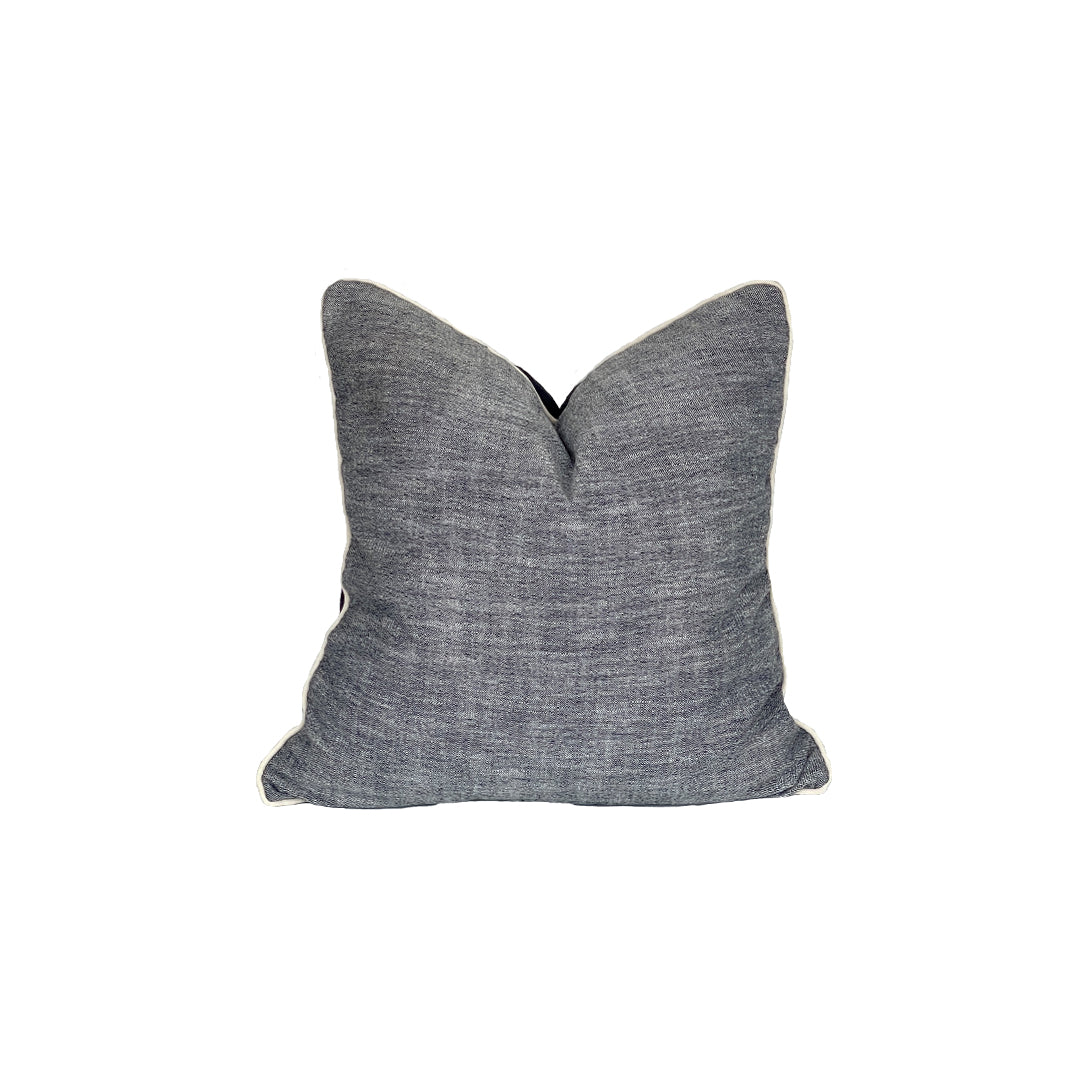 Chamberey pillow with a denim back plate, finished with raw cording is textured, fun and perfect for high activity areas. 