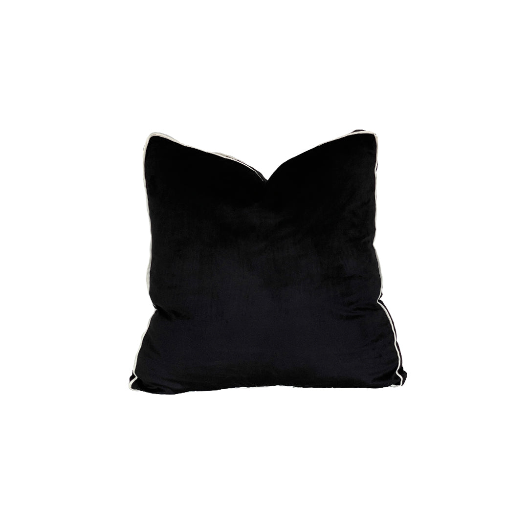 Pitch black Paneled Pillow is panther black velvet accent piece finished off with cordless satin detailing in ivory.