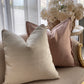 beige and offwhite geometric trellis pillow with pastel pink pillow